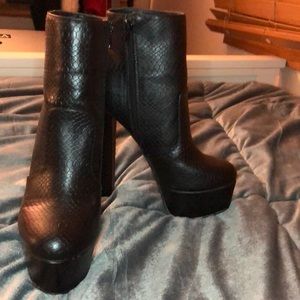 Black snake skin high booties